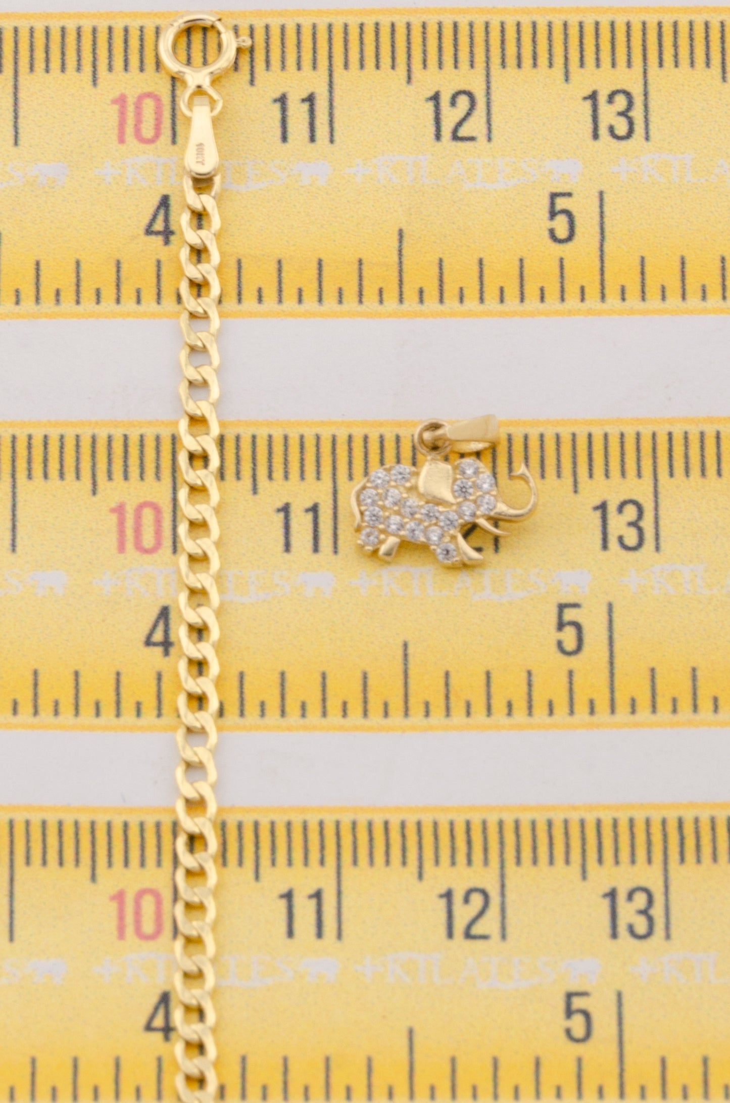 "CADENA DE 50CM PARA ADULTO ESTILO CUBANA CON DIJE DE ESTRELLA DE ELEFANTE CON ZIRCONIA BLANCA. ORO 10K #775-3126"