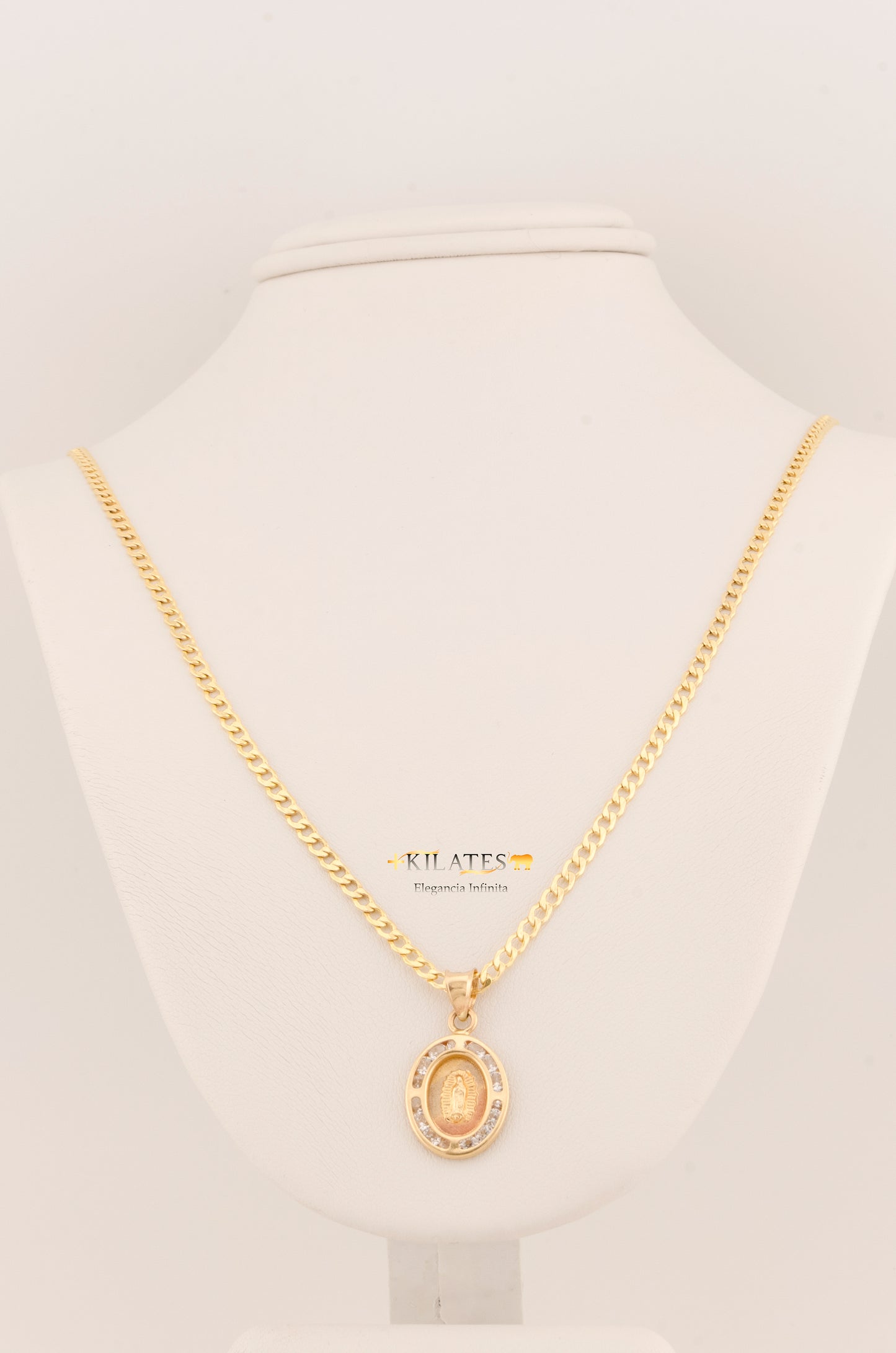 "CADENA DE 50CM PARA ADULTO ESTILO CUBANA CON DIJE DE LA VIRGEN OVALADO MEDIANO CON ZIRCONIA BLANCA . ORO 10K #775-3099"