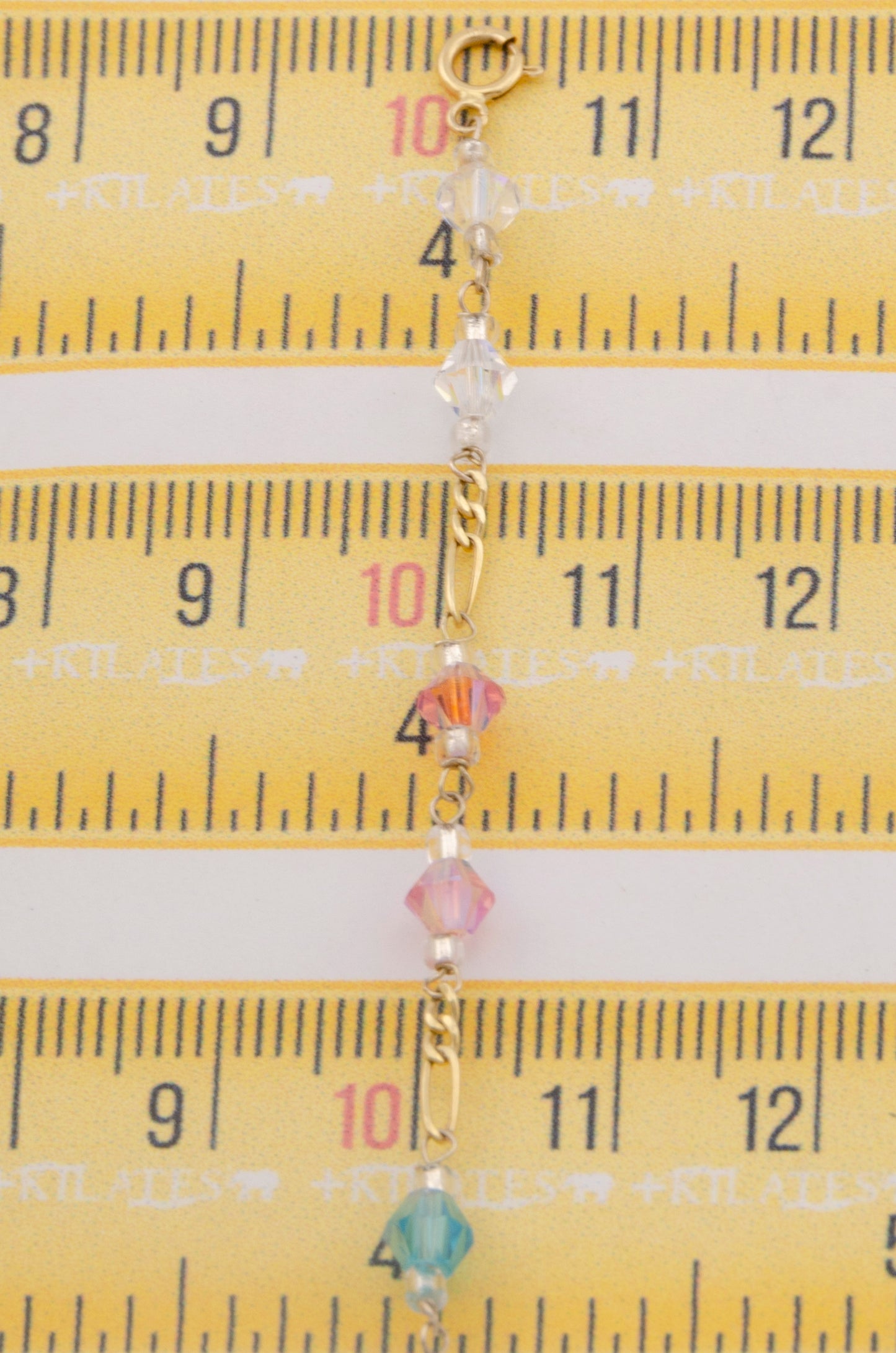 "PULSERA CRISTALES SWAROSKY DE COLORES. ORO 10K #775-3335"