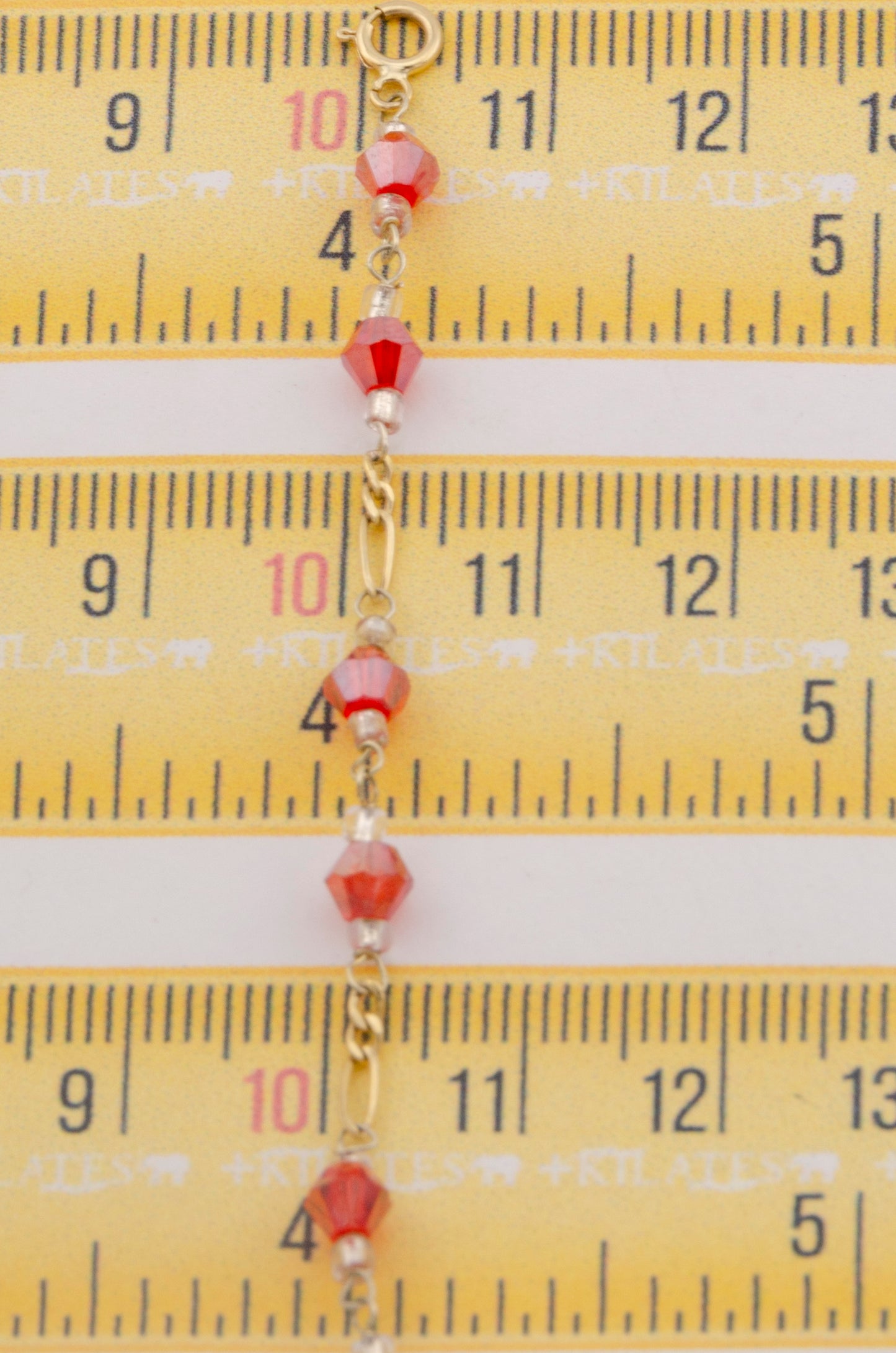 "TOBILLERA PARA ADULTO DE 26CM CON CRISTALES SWAROSKY ROJOS. ORO 10K #775-3338"