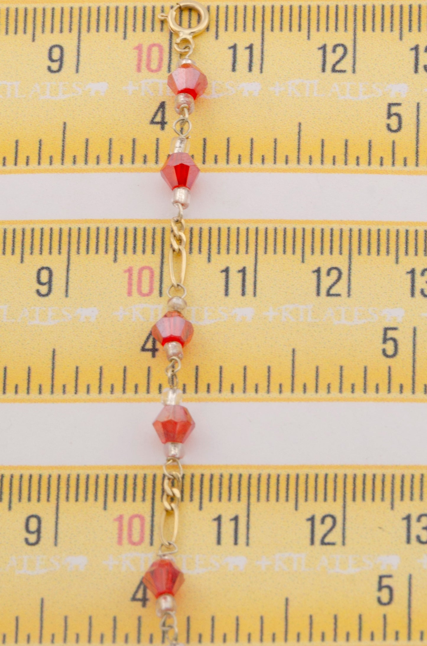 "PULSERA CRISTALES SWAROSKY ROJOS. ORO 10K #775-3336"