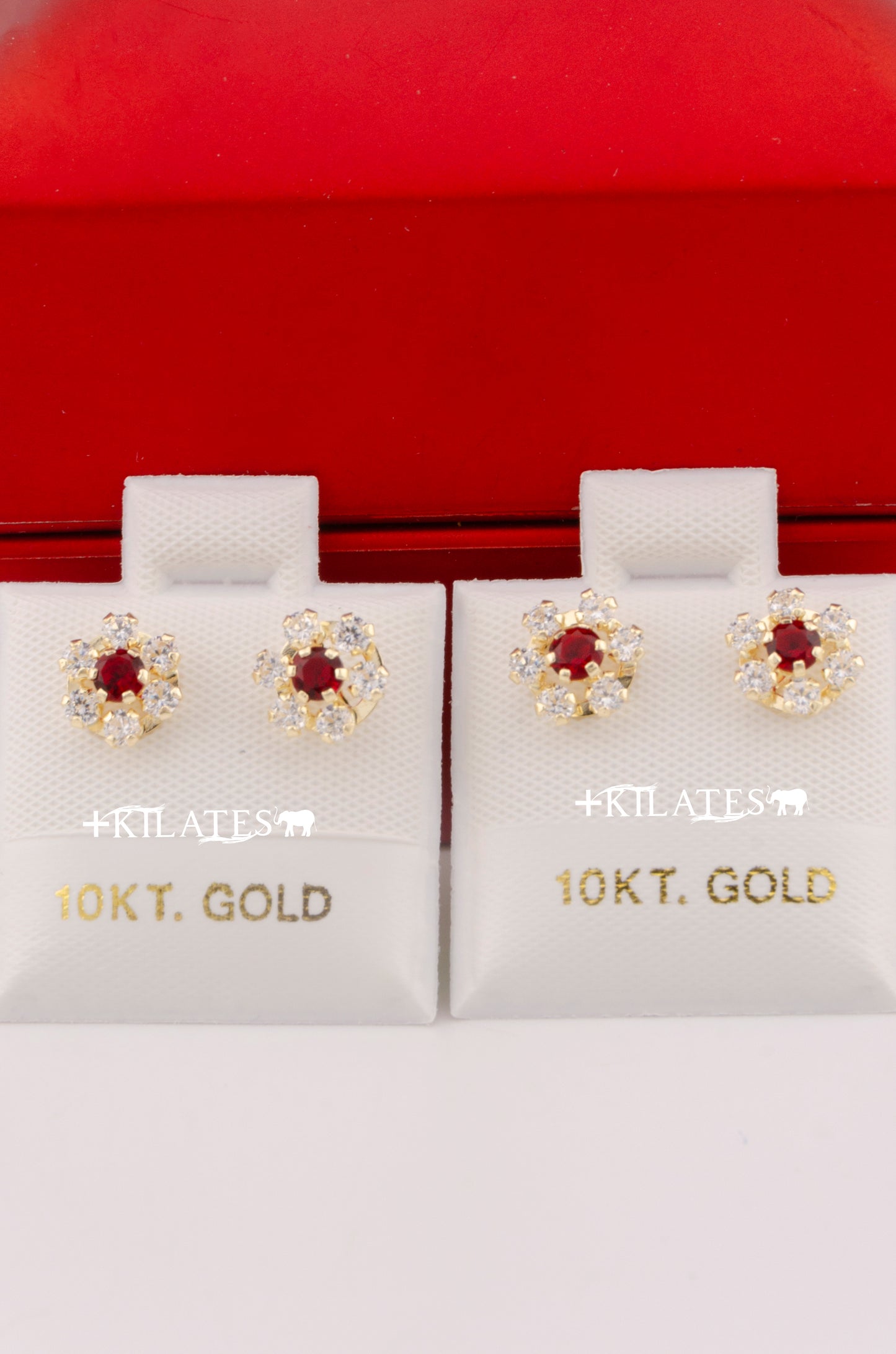 "ARETES PREMIUM DE FLOR DE ZIRCONIA BLANCA CON ROJA . ORO 10K #775-3352"