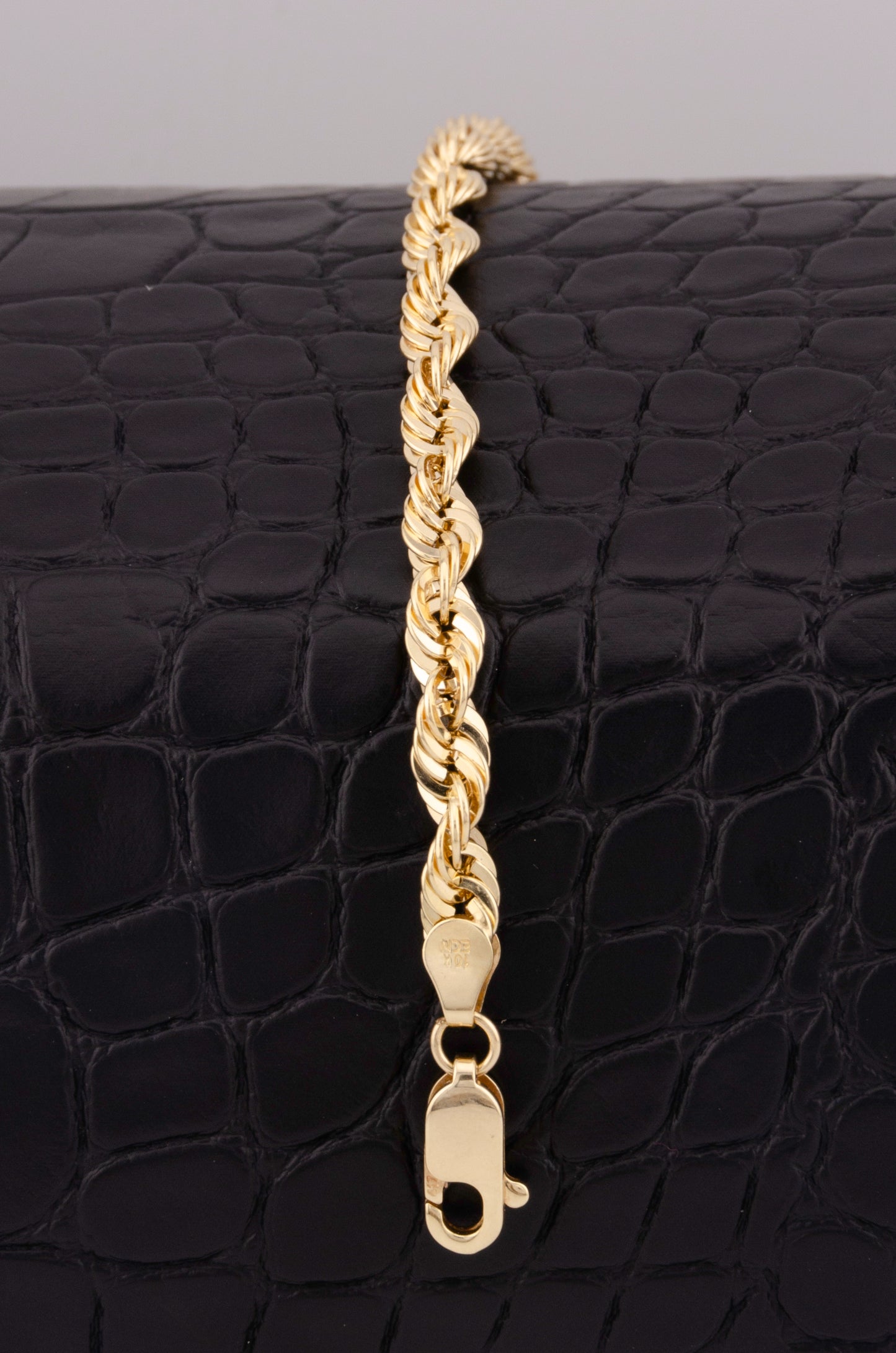 "PULSERA PARA ADULTO DE 20CM ESTILO LAZO. ORO 10K #775-3444"