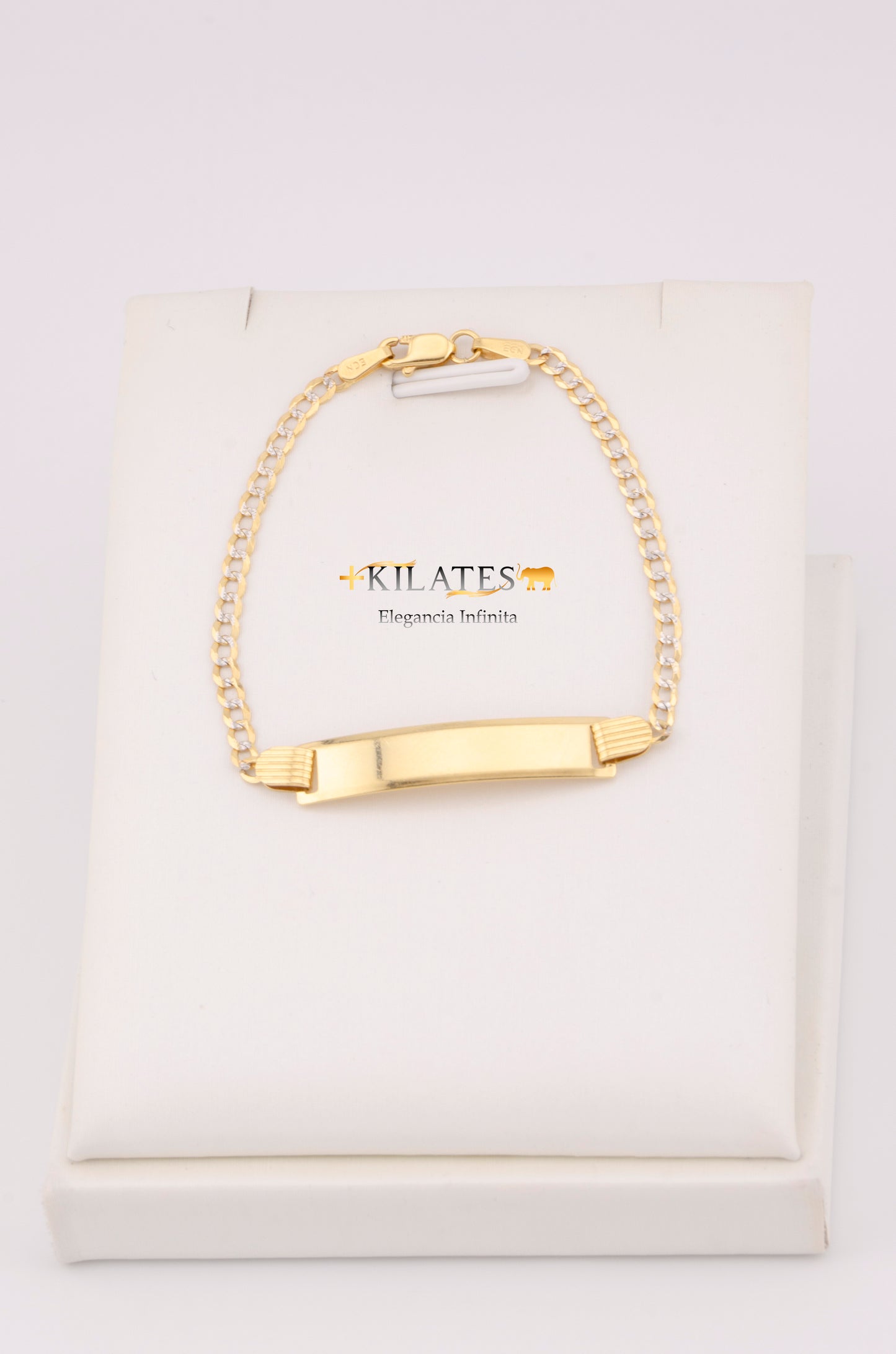 "PULSERA PARA NIÑ0 DE 15.5CM ESTILO CUBANA DIAMANTADA CON PLACA. ORO 10K #775-3450"