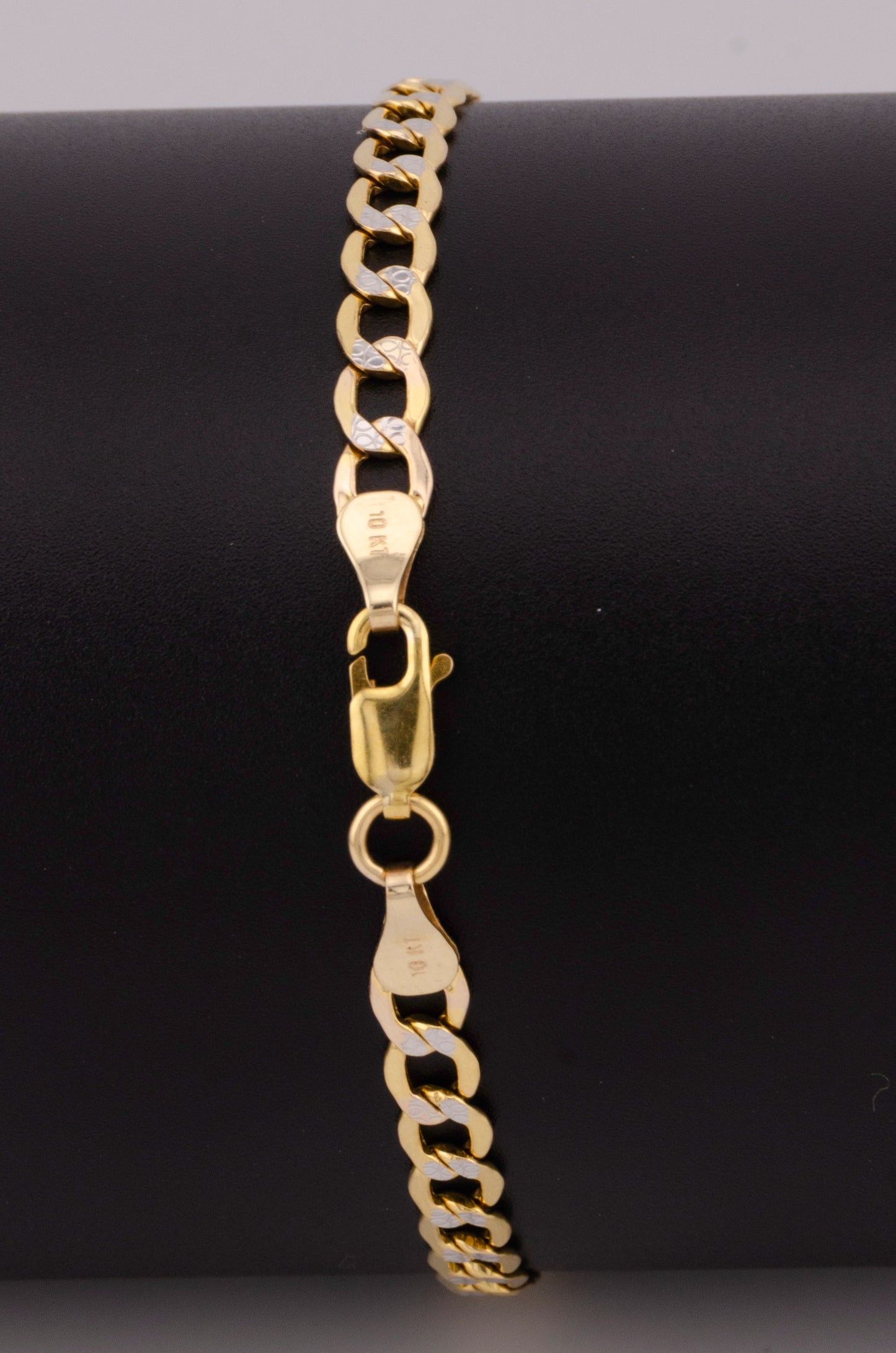 "PULSERA PARA ADULTO DE 19CM ESTILO CUBANA DIAMANTADA. ORO 10K #775-3541"