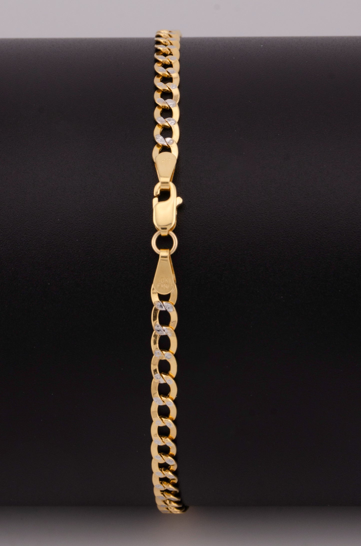 "PULSERA PARA ADULTO DE 18.6CM ESTILO CUBANA DIAMANTADA. ORO 10K #775-3543"