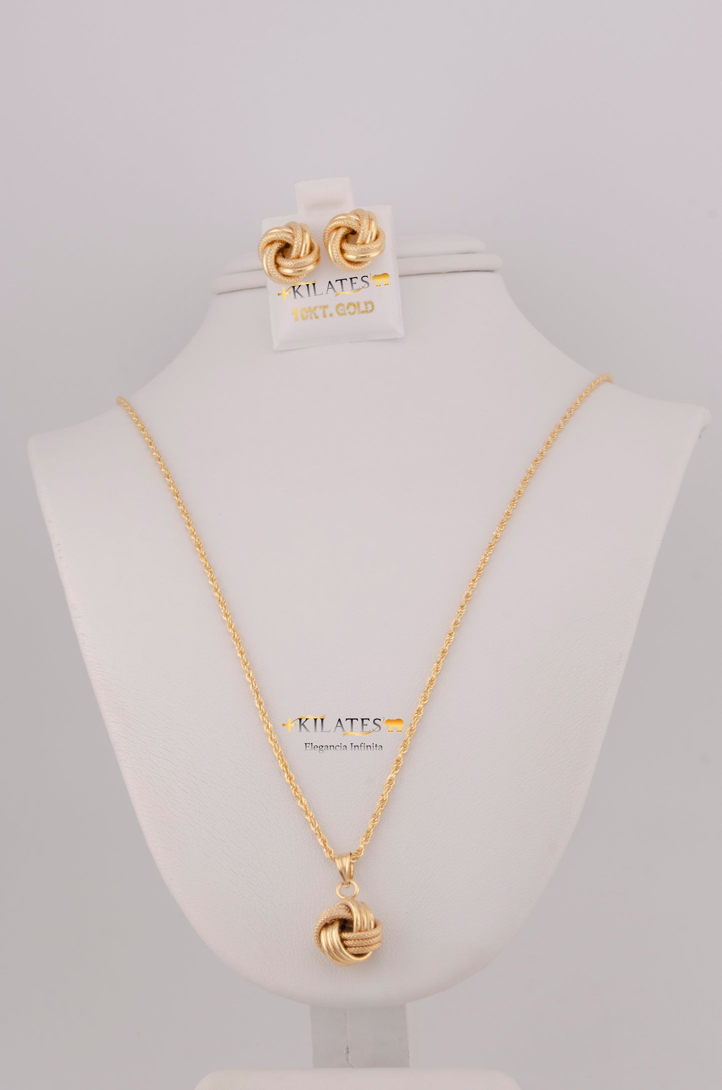 "SET DE CADENA ESTILO LAZO DE 50CM PARA DAMA CON DIJE Y ARETES DE NUDO. ORO 10K #775-3798"