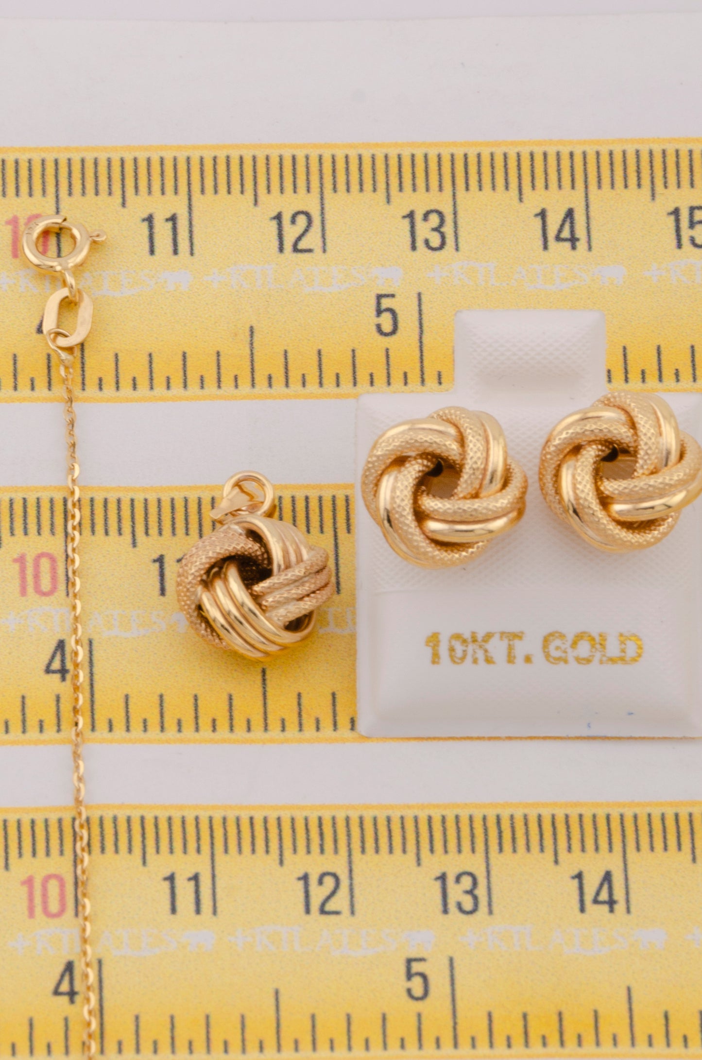 "SET DE CADENA ESTILO CUADRADA SOLIDA DE 50CM PARA DAMA CON DIJE Y ARETES DE NUDO. ORO 10K #775-3809"