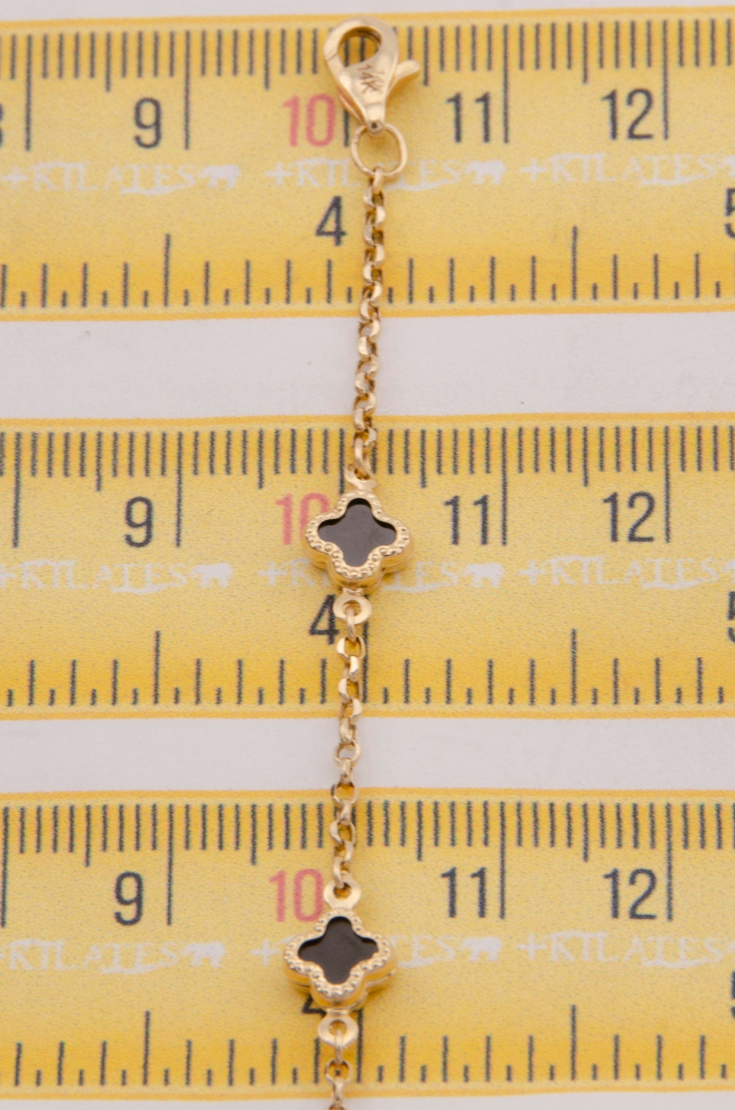 "PULSERA PARA DAMA AJUSTABLE DE 17.6CM-19.5CM CON TREBOLES. ORO 14K #775-3854"