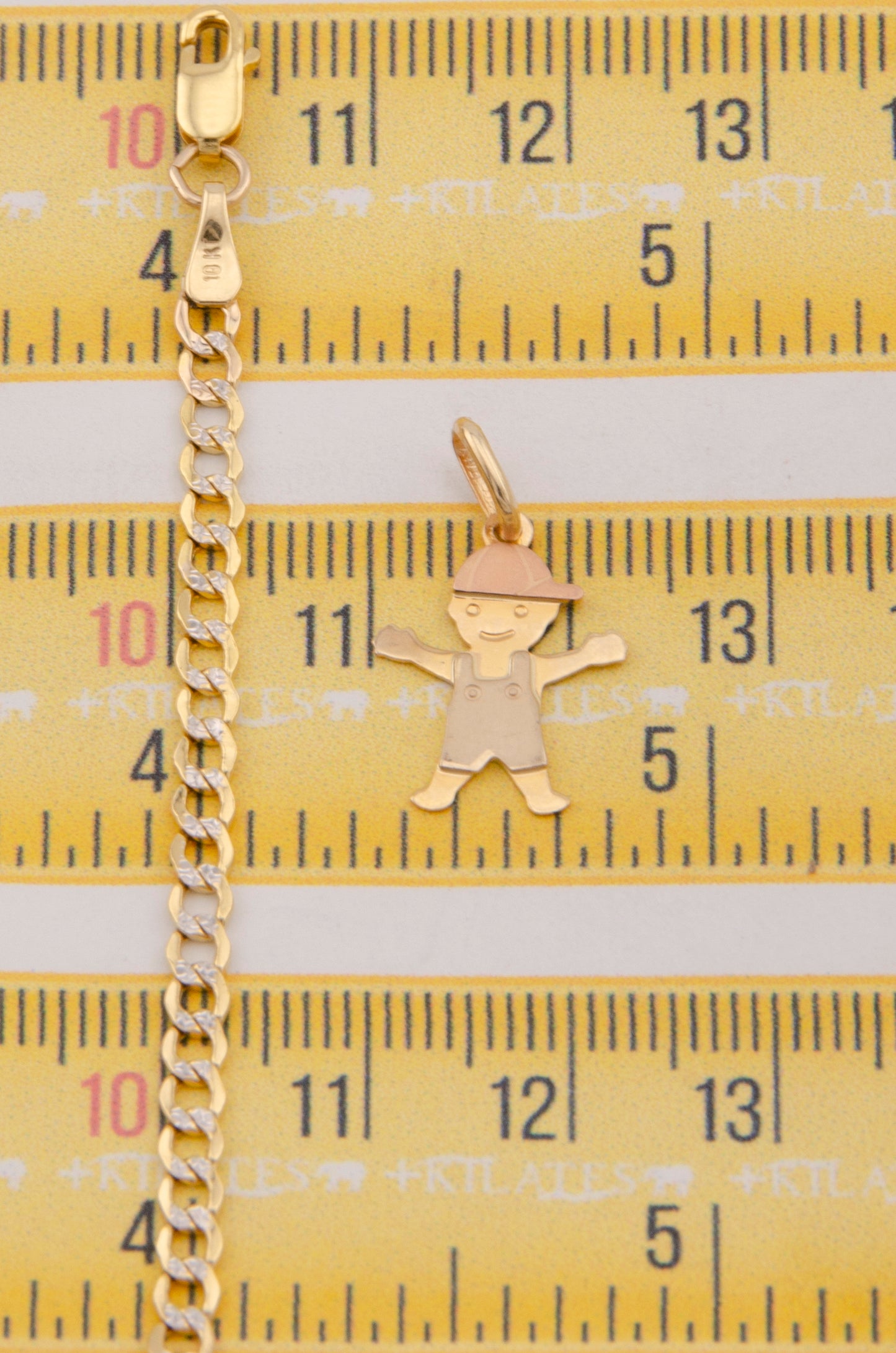 "CADENA PARA NIÑ@ DE 40CM ESTILO CUBANA DIAMANTADA CON DIJE DE NIÑO. ORO 10K #775-3861"
