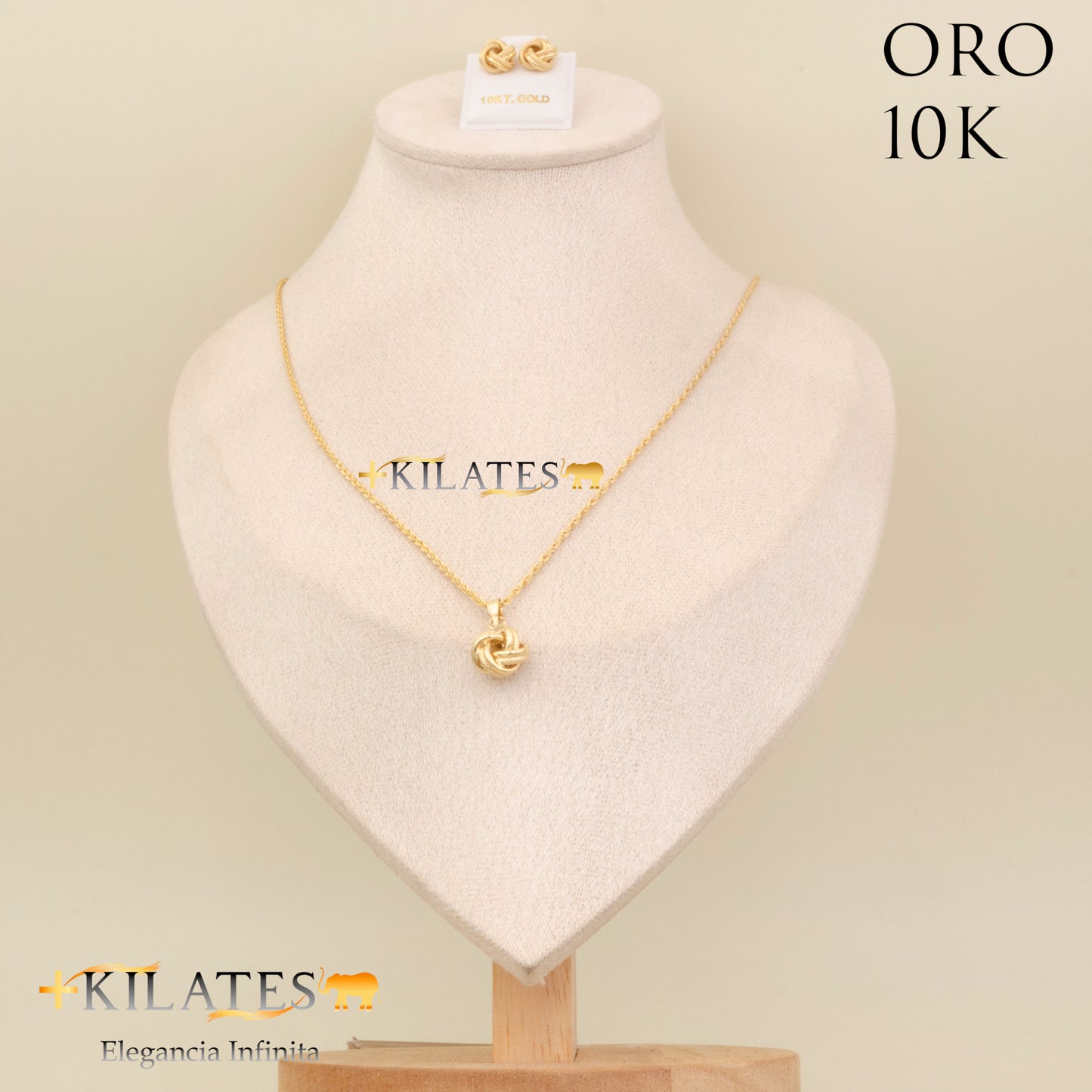 "SET ARETES CON CADENA ESTILO LAZO Y DIJE DE NUDO, 50 CM  . ORO 10K #775-2068"