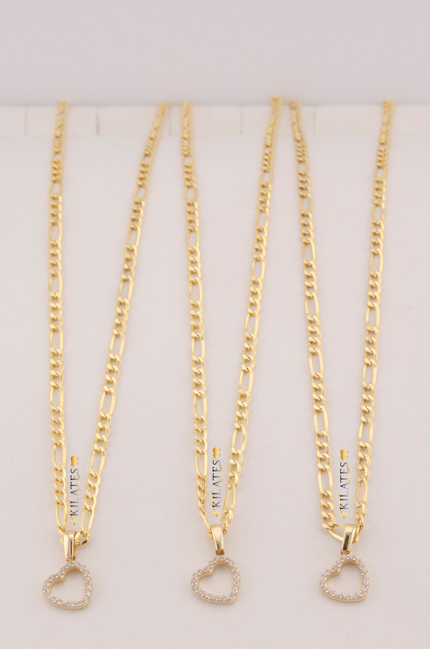 "CADENA  DE 50CM PARA DAMA ESTILO 3+1  CON DIJE DE CORAZON CON PIEDRAS DE ZIRCONIA BLANCA .  ORO 10K #775-3535"