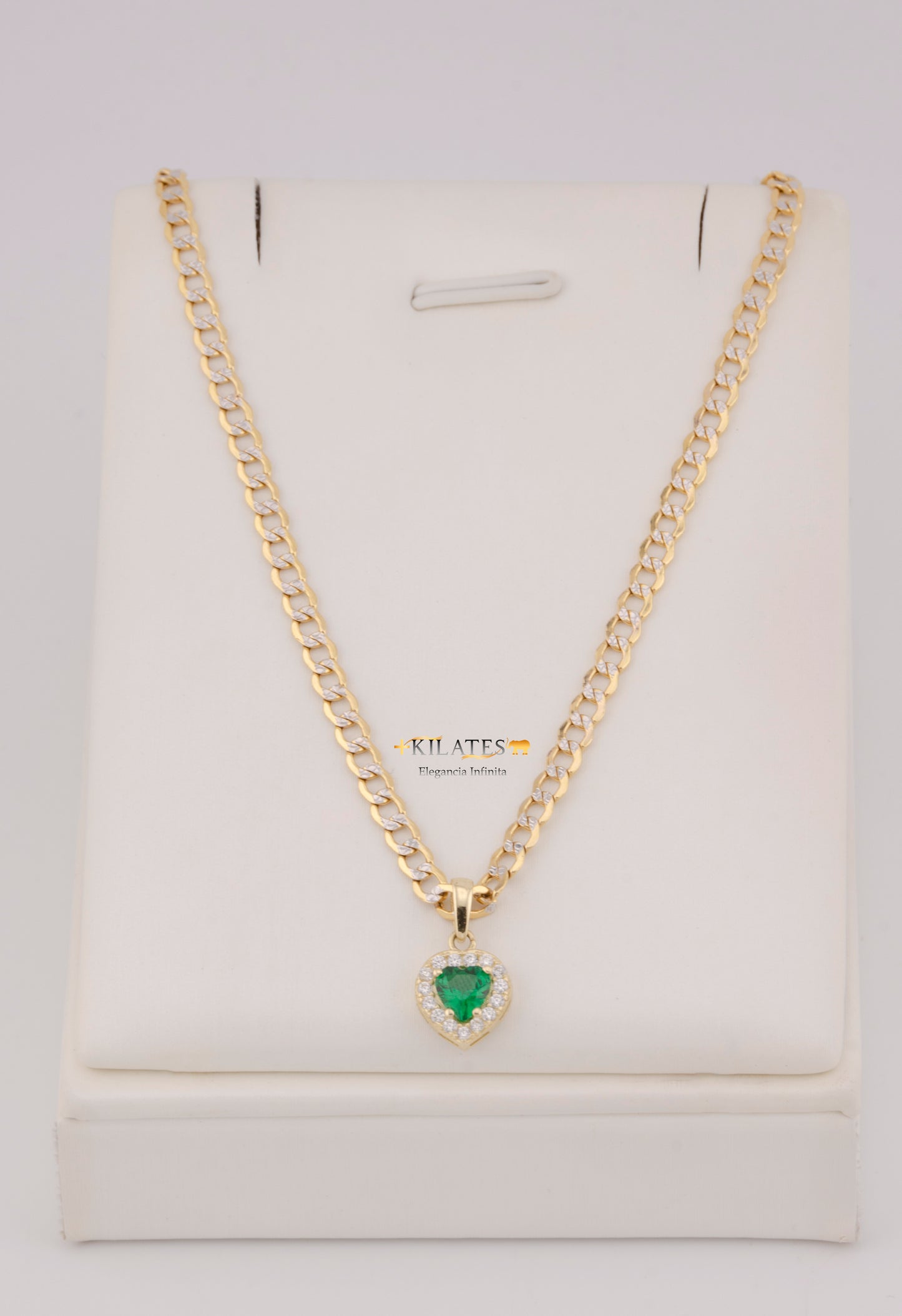 "CADENA DE 50CM PARA DAMA ESTILO CUBANA DIAMANTADA CON DIJE DE CORAZON BLANCO CON VERDE. ORO 10K #775-3830"